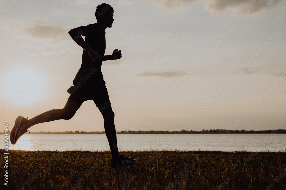 Athlete runner feet running on road, Jogging at outdoors. Man running for exercise.Sports and healthy lifestyle concept. - obrazy, fototapety, plakaty 