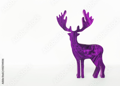Purple wooden reindeer isolate on white background  Christmas concept