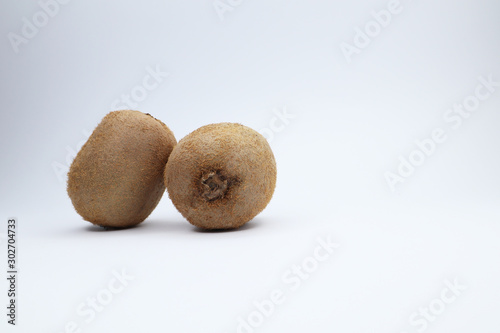 juicy kiwi on a white background. funny smiley with fruits