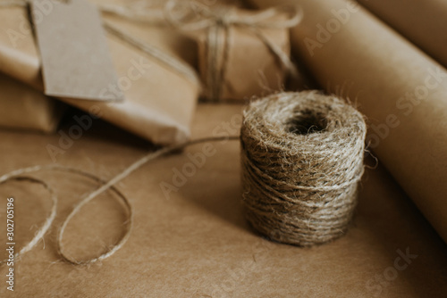 Gift box packaging. Kraft wrapping paper and natural twine. Recycling material. Happy holiday present, surprise. Gifts for boxing day. Delivery service, shipping. Handwork art craft. Celebration event