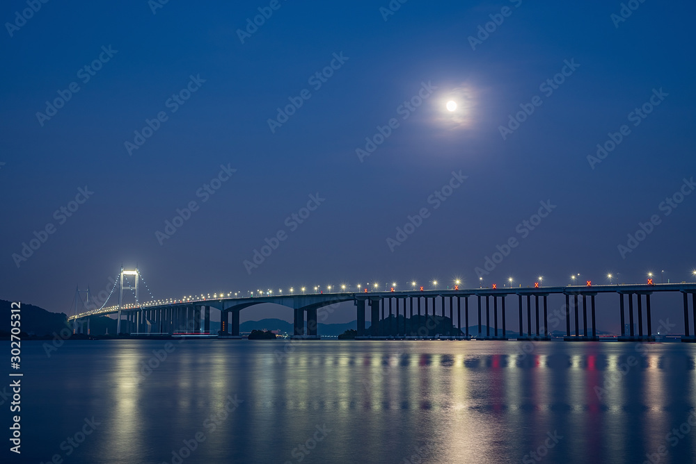 Night view of Humen Bridge on the sea in Zhujiangkou, Guangdong Province, China