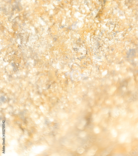 gilted gold confetti sparkle close up