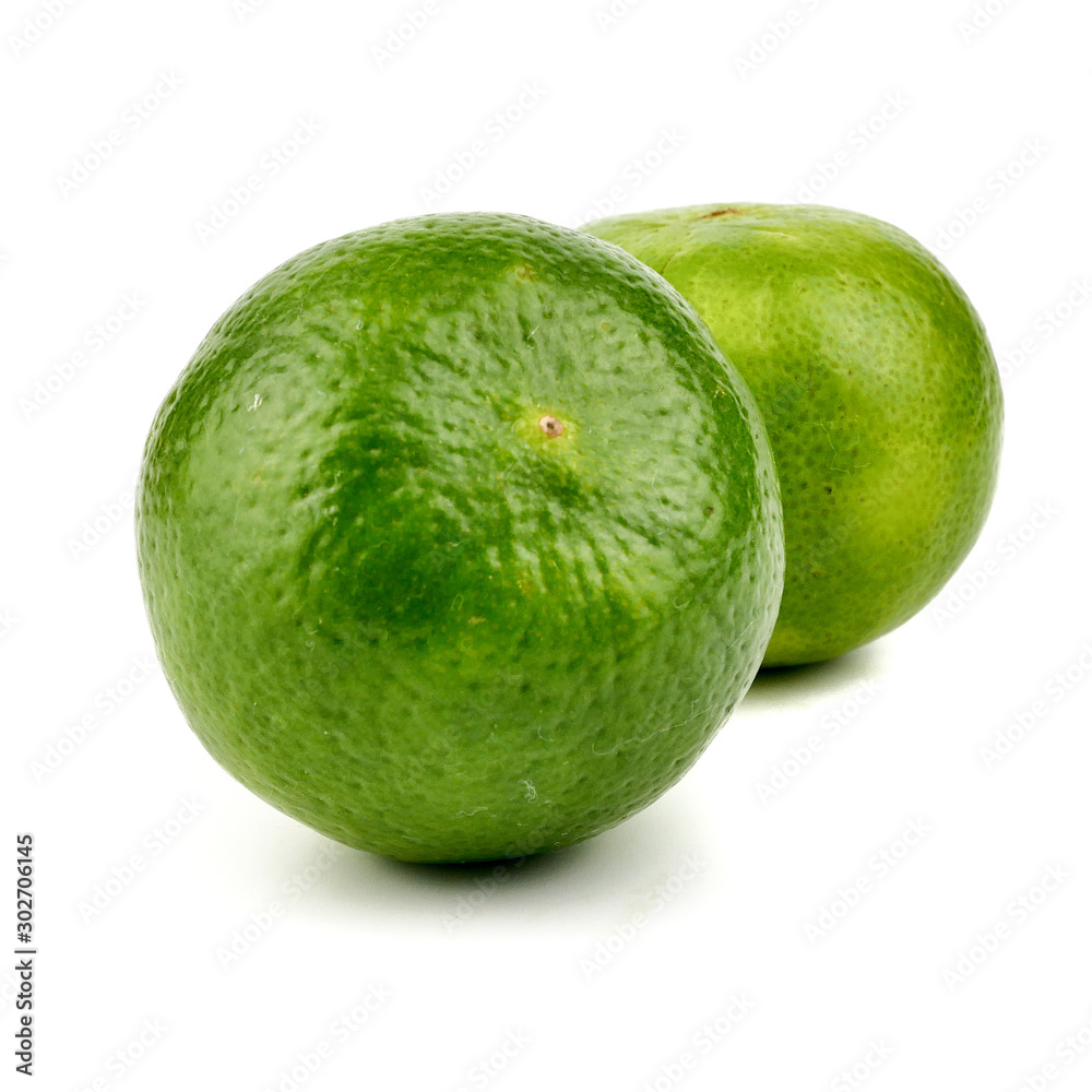 Ripe slice of green lime citrus fruit stand isolated on white background,element of food healthy nutrients and fruit healthy concept Ripe slice of green lime citrus fruit stand isolated on white background,element of food healthy nutrients and fruit healthy concept