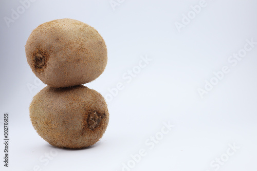 juicy kiwi on a white background. funny smiley with fruits