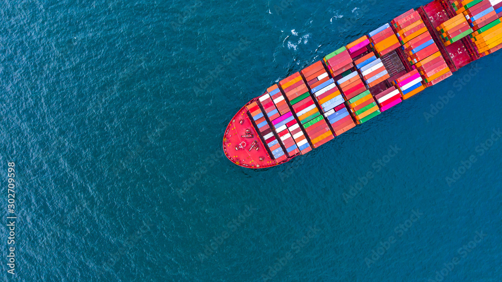 Container ship carrying container for business freight shipping import and export, Aerial view container ship arriving in commercial port. Container ship carrying container for business freight shipping import and export, Aerial view container ship arriving in commercial port.