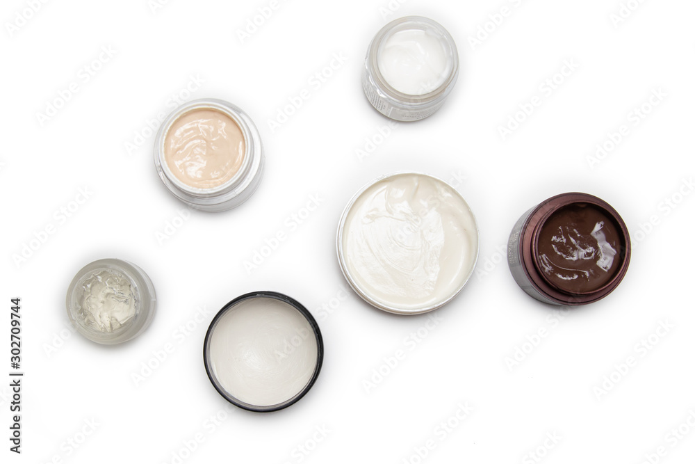 Care products for face, hands and body. Cream in jars on white background Care products for face, hands and body. Cream in jars on white background