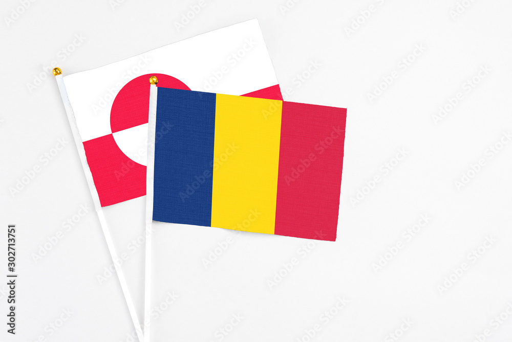 Chad and Greenland stick flags on white background. High quality fabric, miniature national flag. Peaceful global concept.White floor for copy space. Chad and Greenland stick flags on white background. High quality fabric, miniature national flag. Peaceful global concept.White floor for copy space.