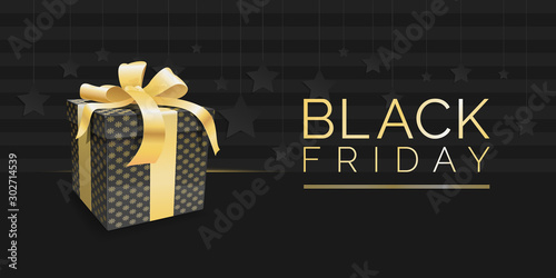 The dark banner for black Friday sale. there is the black gift box with a golden ribbon and golden text they are on the black background with stripes and stars.