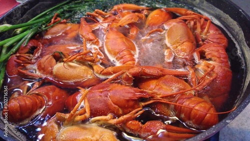 Cooking freshwater crayfish in a pan.