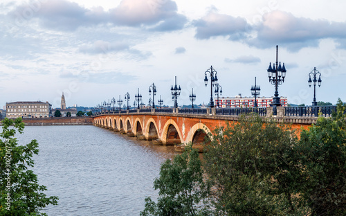 Panoramic view of Bordeaux with Saint Michel cathedral and Pont de Pierre, old stone bridge over the river Garonne.