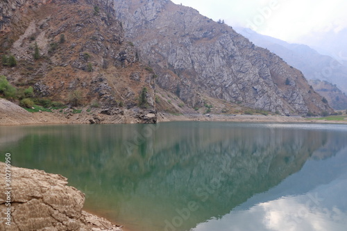 Fototapeta Naklejka Na Ścianę i Meble -  Picturesque Urungach lake in mountains on early autumn in Uzbekistan