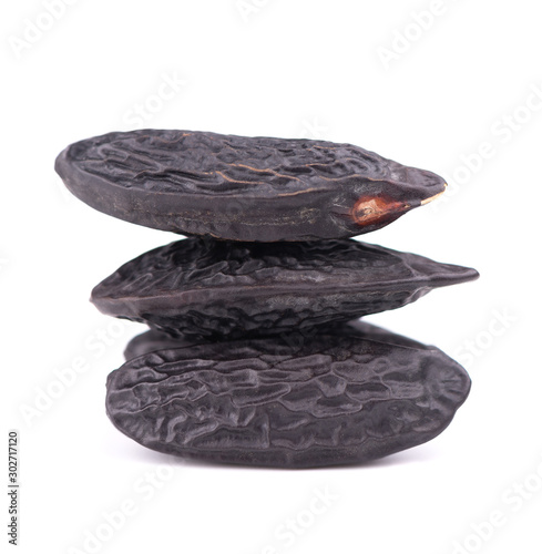 Tonka beans isolated on white background. Bean of Dipteryx odorata, cumaru or kumaru. Fresh aroma tonka beans. photo