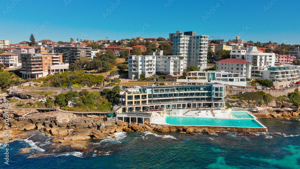 Fototapeta premium Amazing aerial view of Bondi Beach landscape in Sydney, Australia. Drone viewpoint on a sunny morning