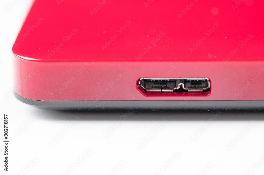Red external hard with cable isolated on white background.Copy space Red external hard with cable isolated on white background.Copy space
