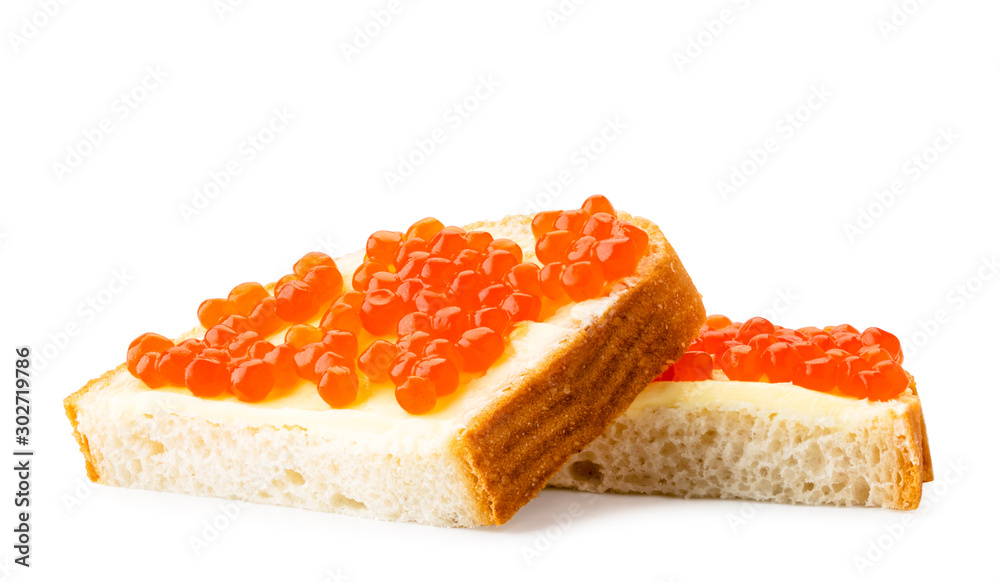Two slices of bread with red caviar and butter on a white background. Isolated Two slices of bread with red caviar and butter on a white background. Isolated