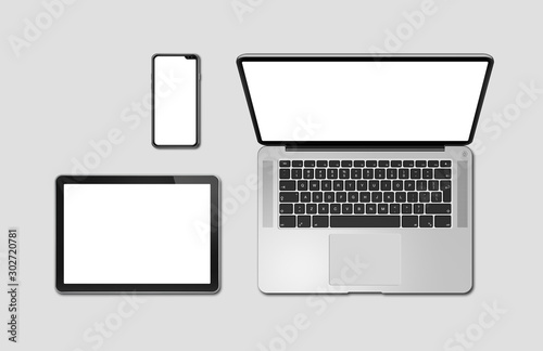 Laptop, tablet and phone set mockup isolated on grey. 3D render