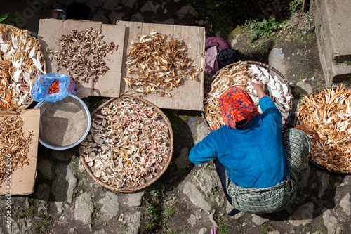 A woman sellings dry aliments in Namche bazaar on the everest base camp trek, Nepal