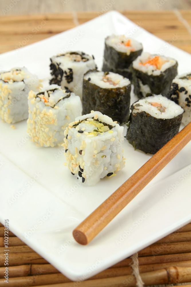 several makis on a plate