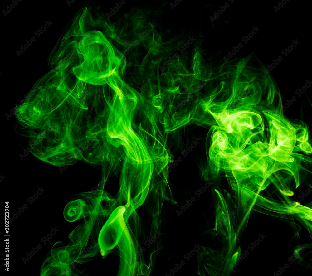 Green smoke on black background Green smoke on black background