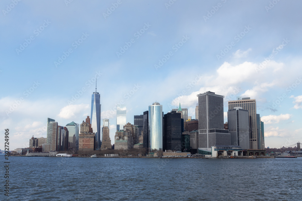 New York City Manhattan downtown skyline with skyscrapers illuminated over Hudson River panorama. USA Trade Center.