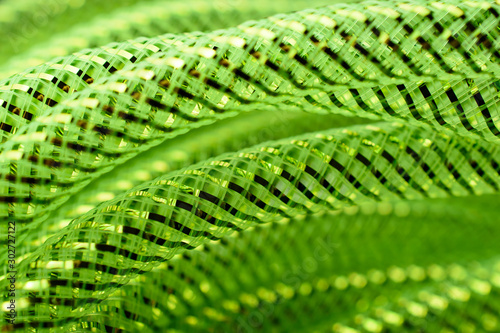 Close-up of neon green mesh craft tubing