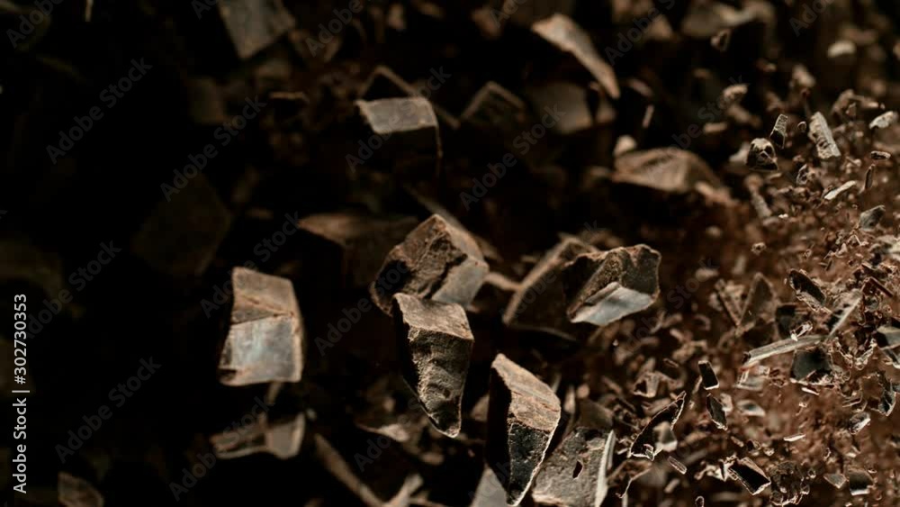 Super slow motion of flying group of raw chocolate pieces. Filmed on high speed cinema camera, 1000fps. Super slow motion of flying group of raw chocolate pieces. Filmed on high speed cinema camera, 1000fps.