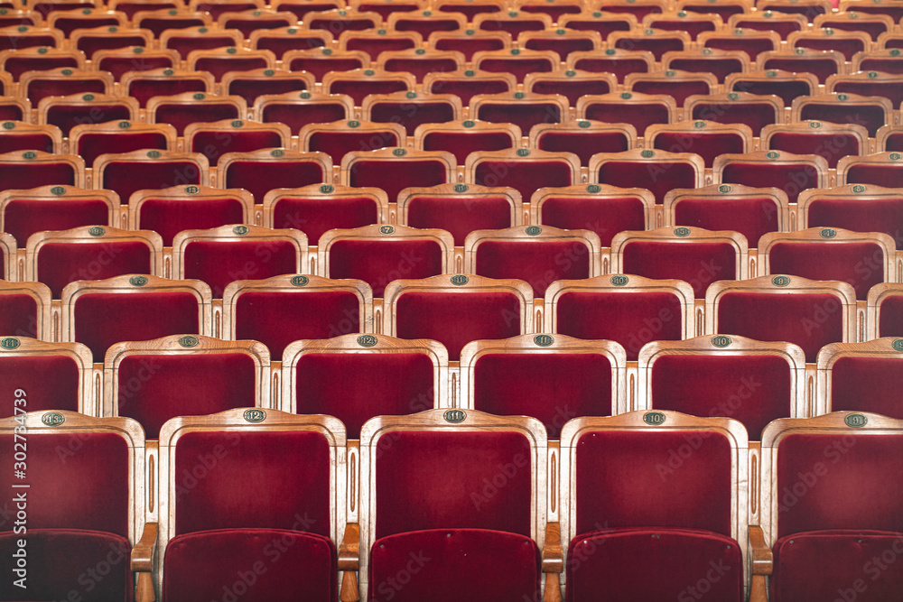 Naklejka premium Row of red seats in theatre