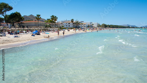 Beach in the resort town of Port Alcudia on the island of Mallorca