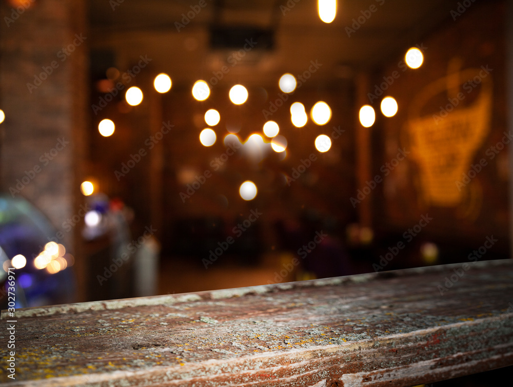 blurred cafe restaurant club background with wooden table blurred cafe restaurant club background with wooden table