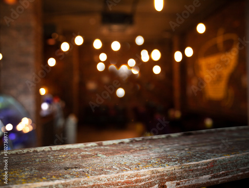 blurred cafe restaurant club background with wooden table