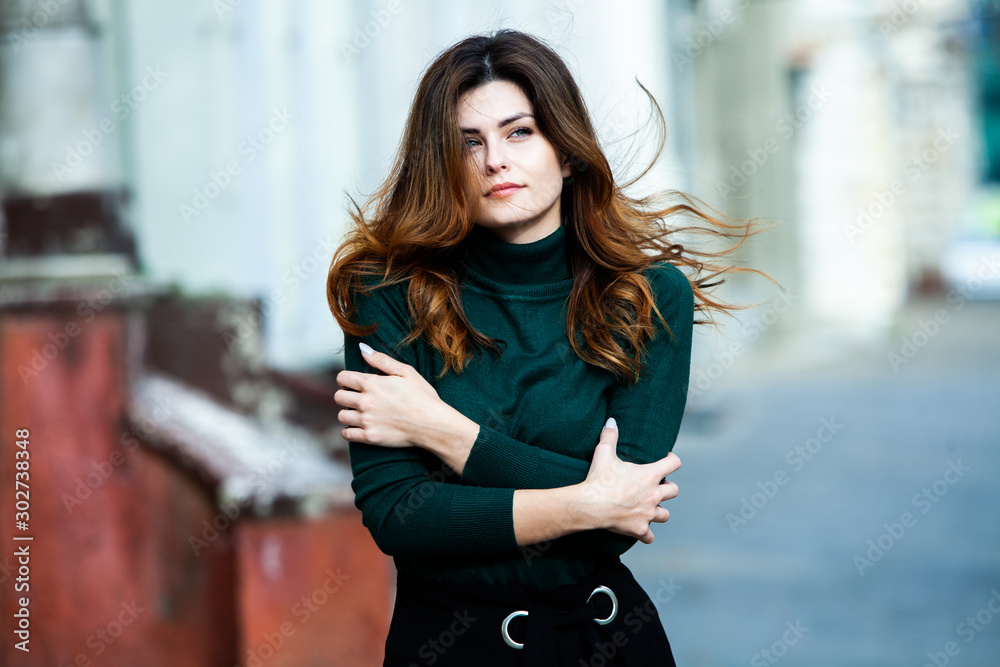Fototapeta premium Beauty portrait of female face with natural skin. Beauty portrait of female face. Gorgeous young model woman posing in the city. Wonderful white female. Stylish girl. Hipster. Russian.