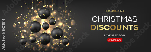 Christmas and New Year sale background. Holiday vector illustration with realistic black balls, gold confetti and effect bokeh on black background. Festive card with shape of tree from Xmas balls.