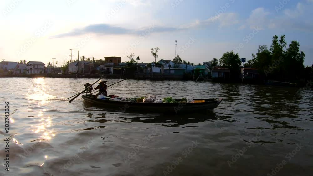 Sunrise trader cruising the Mekong river Vietnam Asia Sunrise trader cruising the Mekong river Vietnam Asia