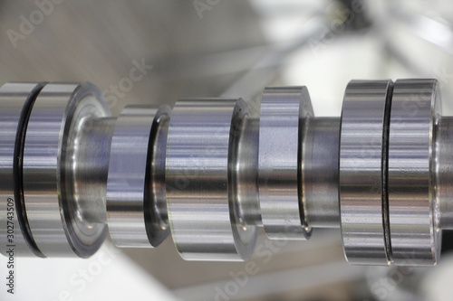 Cams on new car engine camshaft close up photo
