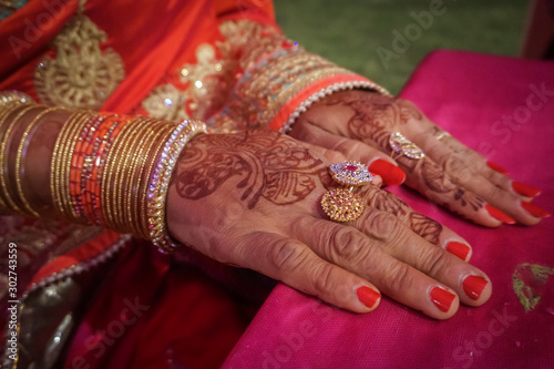 Indian woman's hand painted mehendi