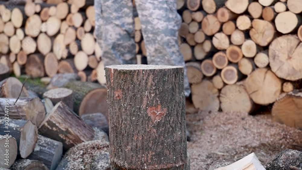 Lumberjack chopping firewood using axe, logs splitting. splitting wood and cutting firewood. slow motion Lumberjack chopping firewood using axe, logs splitting. splitting wood and cutting firewood. slow motion