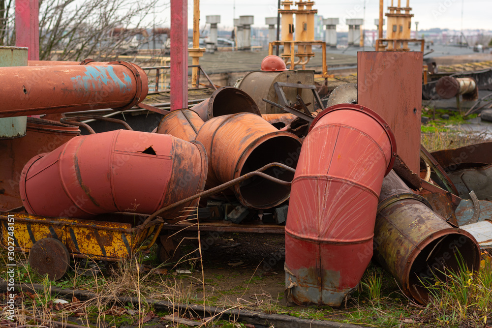 discarded old metal ducts. abandoned metal dump. factory roof discarded old metal ducts. abandoned metal dump. factory roof