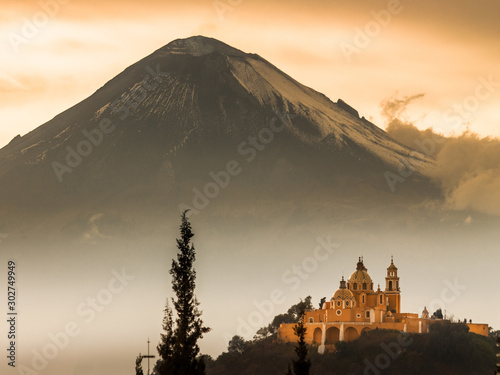Mexican church with volcano photo