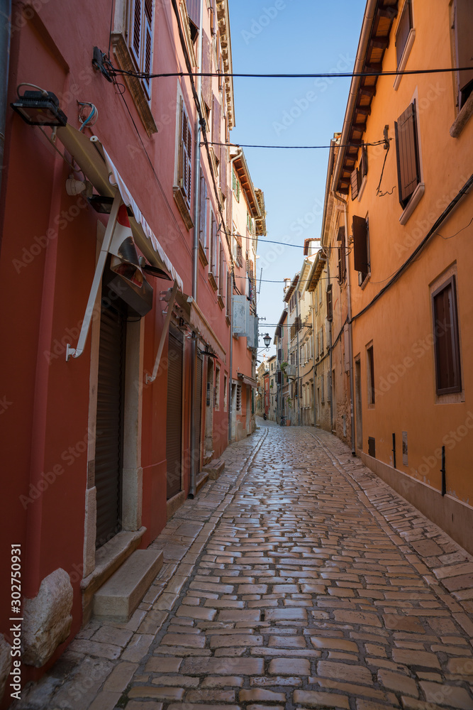 Rovinj. Croatia. A narrow deserted street, covered with white limestone.