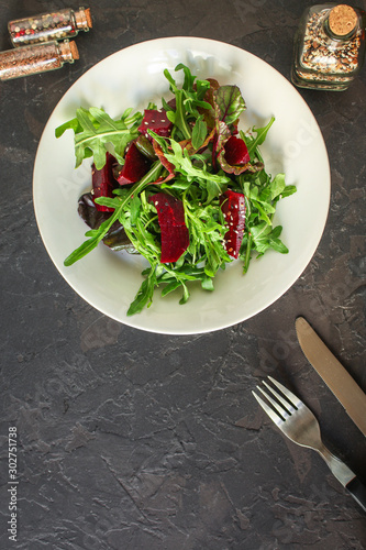 salad beetroot and leaf mix (lettuce, arugula, red chard and more) menu concept. food background. top view. copy space