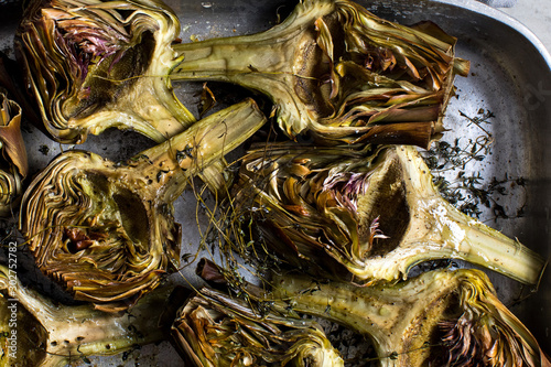 Close up of roasted artichokes on baking tray