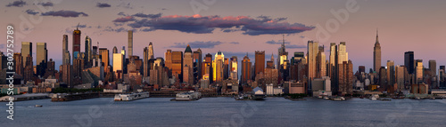 New York City sunset on the skyscrapers of Midtown West. Panoramic view on Manhattan and the Hudson River banks, NY, USA