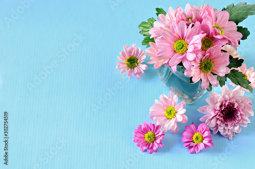 Bouquet of bright colors on the blue background with copy space.