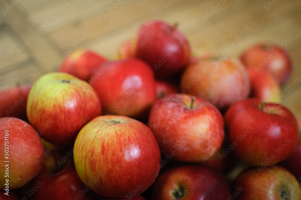 Sweet ripe red juicy apples on wooden background, healthy eating and vegetarian lifestyle concepts. Sweet ripe red juicy apples on wooden background, healthy eating and vegetarian lifestyle concepts.