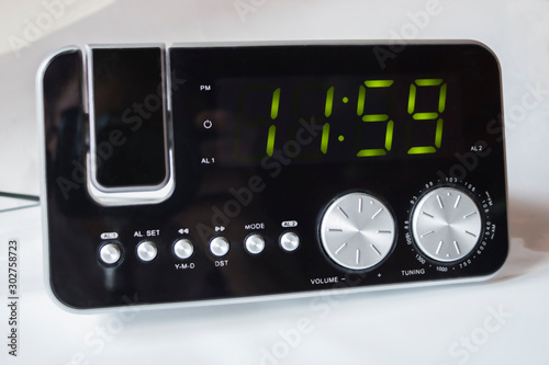 Electronic clock radio shows me 11:59