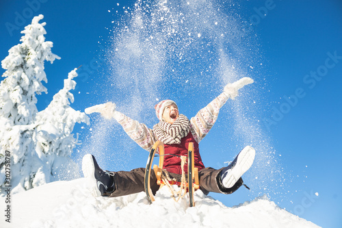 older woman on snowboard