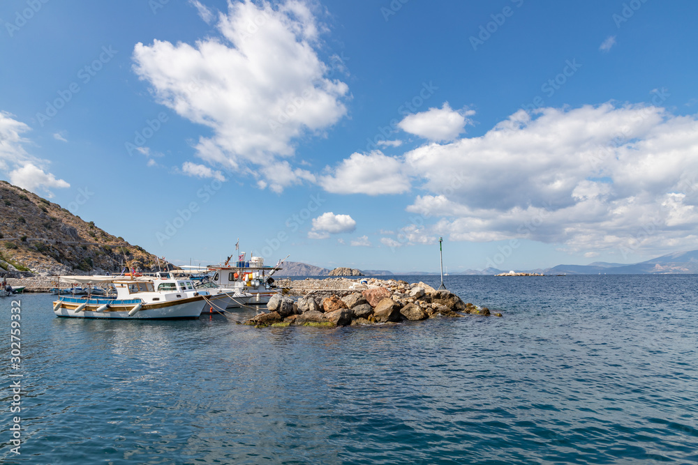 Boats and Pier in Kamini beach in Hydra Island
