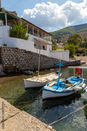 Boats and Pier in Kamini beach in Hydra Island photo