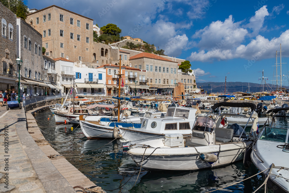 Boats and buildings around pier in Hydra Island