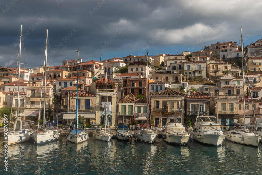Boats and houses in a village in Poros Island